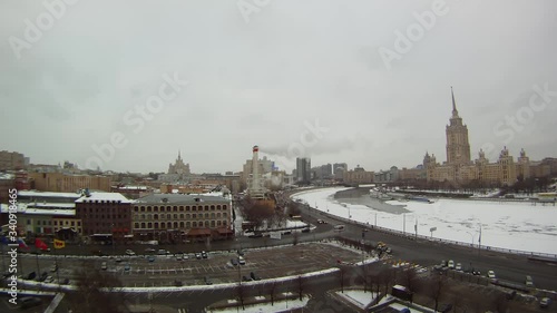 Timelapse - Day to Night - of the frozen Moscva River in Moscow, Russia with beautiful moving clouds and steam from some chimneys