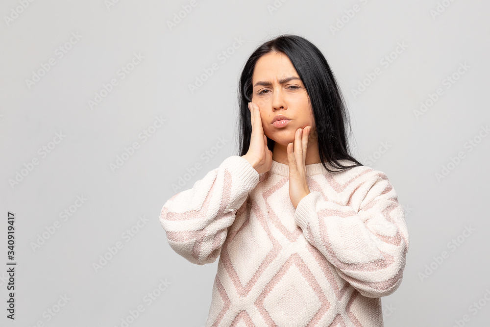 Tooth Pain And Dentistry. Beautiful Young Woman Suffering From Terrible Strong Teeth Pain, Touching Cheek With Hand. Female Feeling Painful Toothache. Dental Care And Health Concept. High Resolution Tooth Pain And Dentistry. Beautiful Young Woman Suffering From Terrible Strong Teeth Pain, Touching Cheek With Hand. Female Feeling Painful Toothache. Dental Care And Health Concept. High Resolution