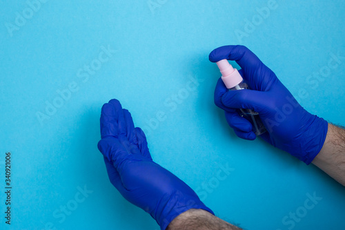 Coronavirus prevention hand sanitizer gel for hand hygiene corona virus protection isolated on blue