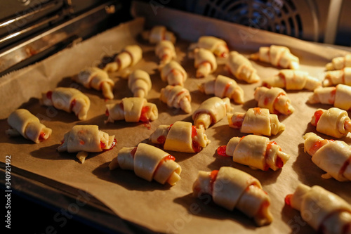 yeast croissants with jam in the oven