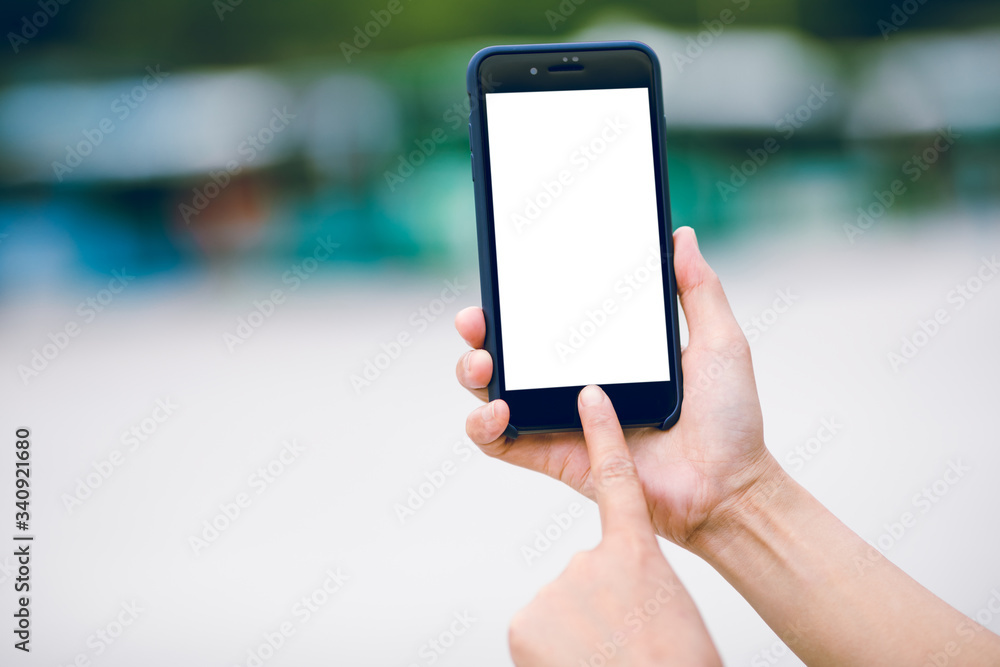 Asian woman using smartphone outdoors Asian woman using smartphone outdoors