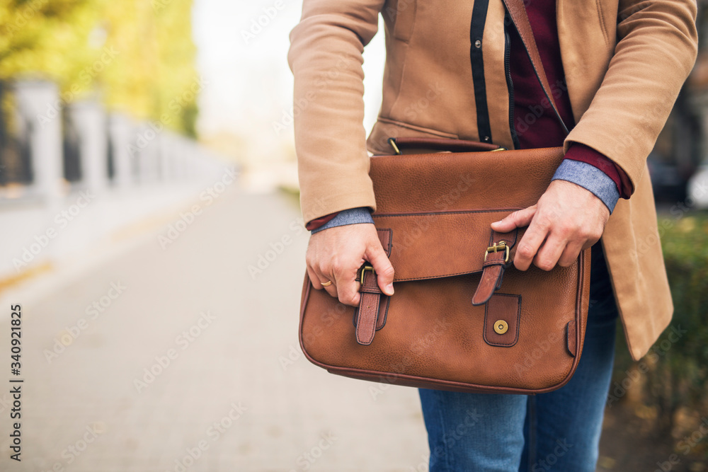 Close up of a businessman holding a briefcase. Close up of a businessman holding a briefcase.