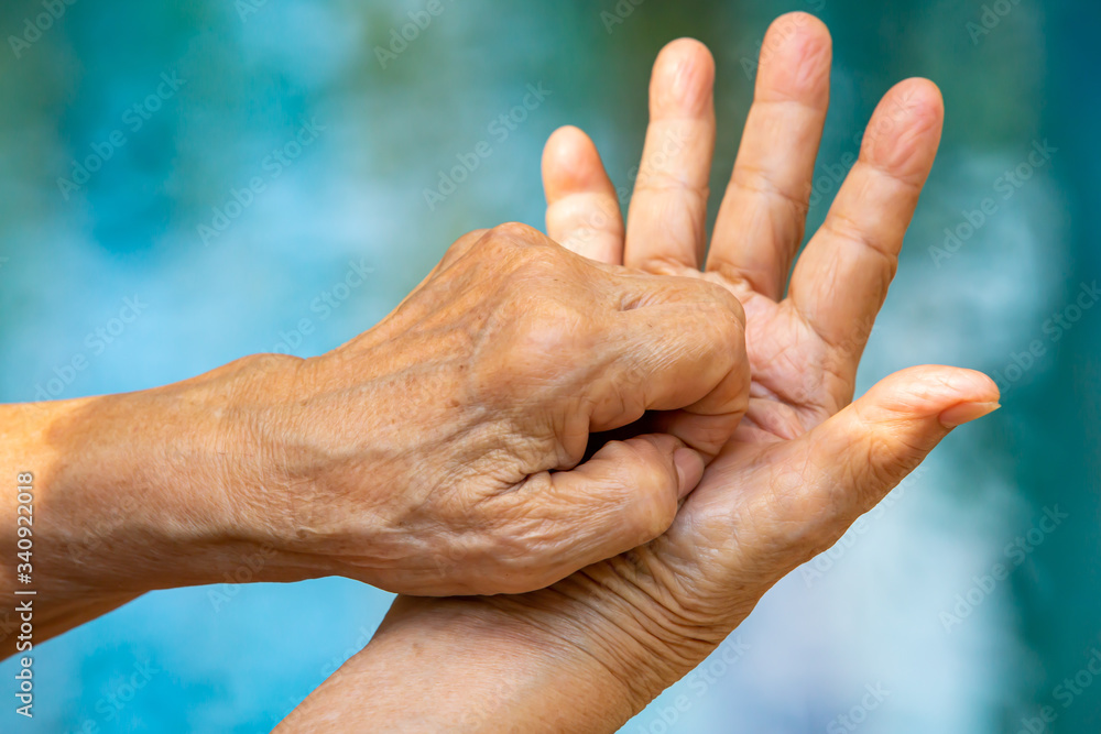 Fototapeta premium Senior woman's hands washing her hands in step 6 on bokeh blue pool background, Close up & Macro shot, Selective focus, Prevention from covid19, Bacteria, healthcare concept, 7 step wash hand