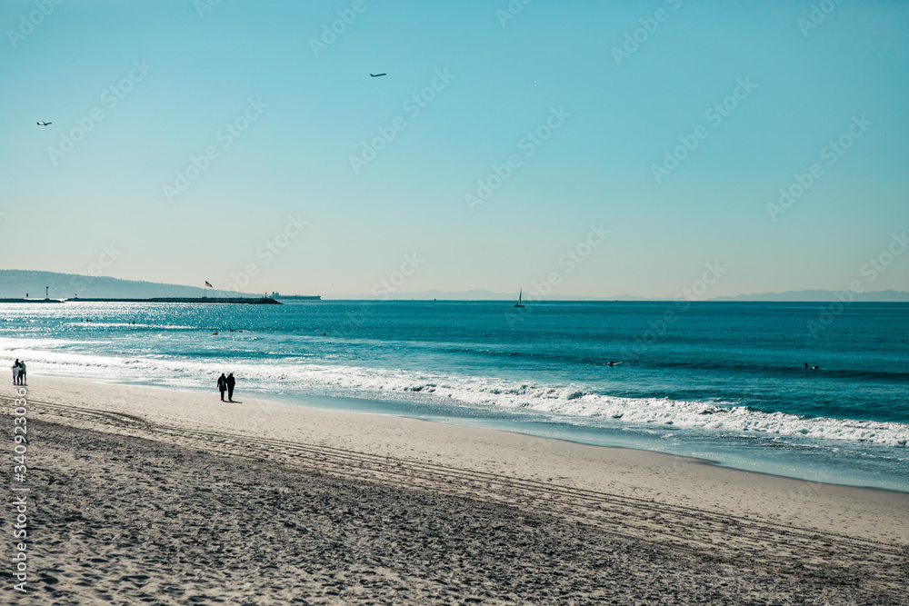 People walking along the beach. Ocean morning. LA. Los Angeles. California.