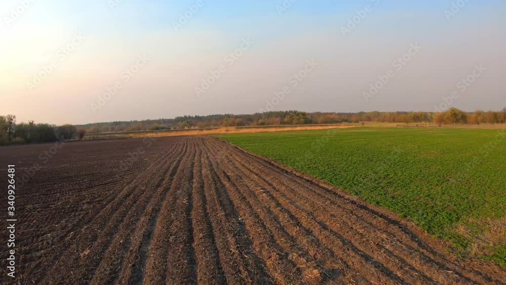 FPV aerial proximity flying above farm lands in countryside. Authentic creative shot on fpv racing drone FPV aerial proximity flying above farm lands in countryside. Authentic creative shot on fpv racing drone