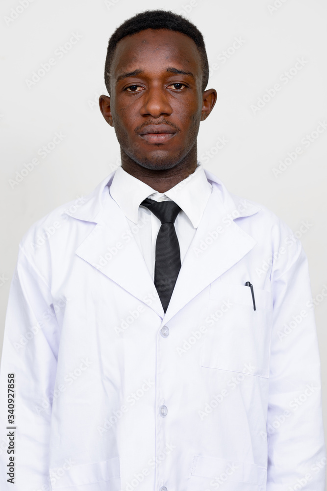 Portrait of young African man doctor looking at camera Portrait of young African man doctor looking at camera