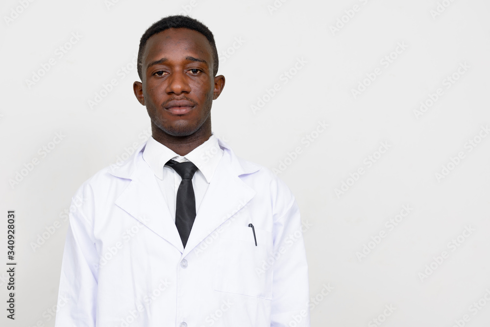 Portrait of young African man doctor looking at camera Portrait of young African man doctor looking at camera