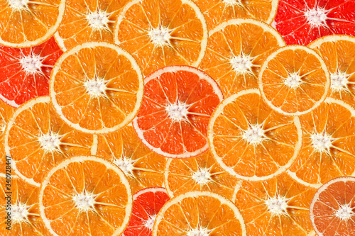Citrus fruits background. Seamless pattern with pieces of orange, lemon, lime, grapefruit and kumquat