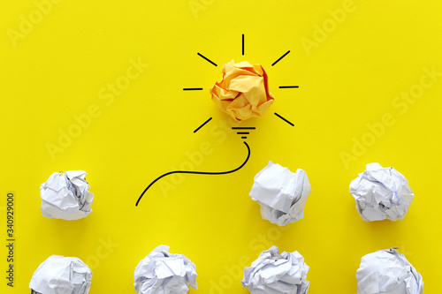 Education concept image. Creative idea and innovation. Crumpled paper as light bulb metaphor photo