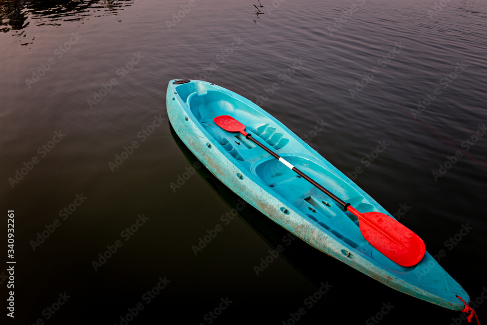 Blue Canoe on river. kayaking on lake.Water activity Blue Canoe on river. kayaking on lake.Water activity
