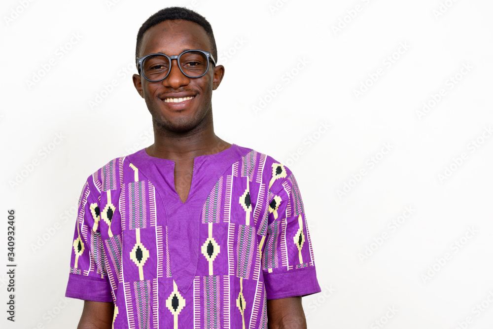 Portrait of happy young African man in traditional clothing Portrait of happy young African man in traditional clothing