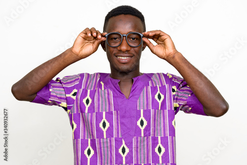 Portrait of happy young African man in traditional clothing