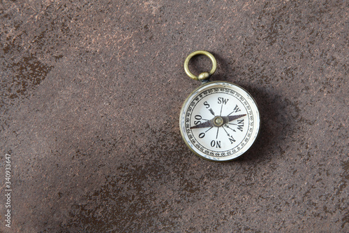 Compass on a wooden background 