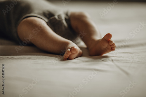 Little foot of child on the bed