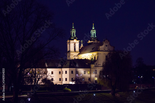 View from the Grunwaldzki bridge on church  near Vistula river at night. Selective focus, long exposure © Blumesser