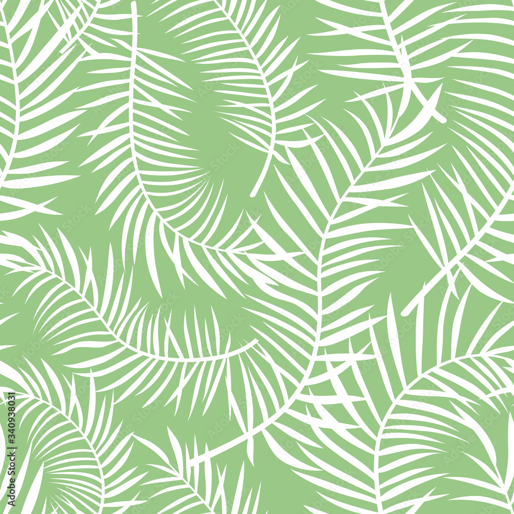 White palm leaves silhouettes at light green seamless pattern.