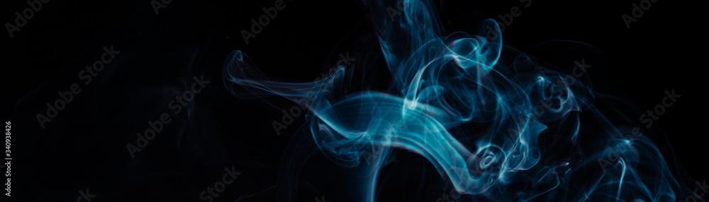 Blue smoke on black background