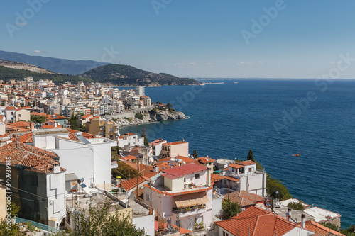 Aerial panoramic view of Greek resort Kavala, big port with old fortress and old town © yegorov_nick
