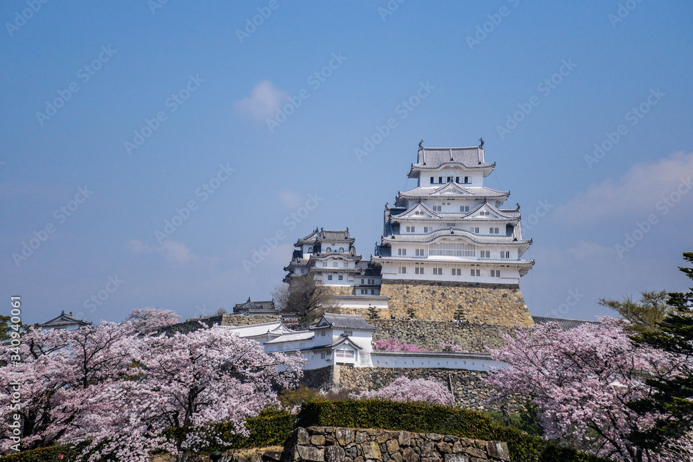 Iconic white traditional castle above the small city of Himeji, Japan Iconic white traditional castle above the small city of Himeji, Japan