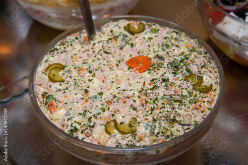 Russian salad in bowl close up