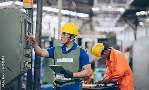technician engineer control buttom to machinery in factory