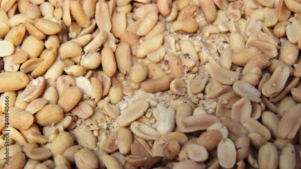 Background of roasted peanuts with salt, closeup Background of roasted peanuts with salt, closeup