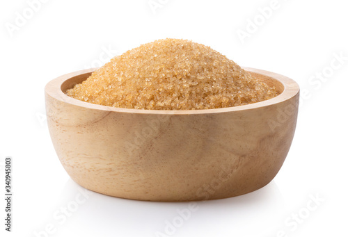brown sugar in wood bowl on white background