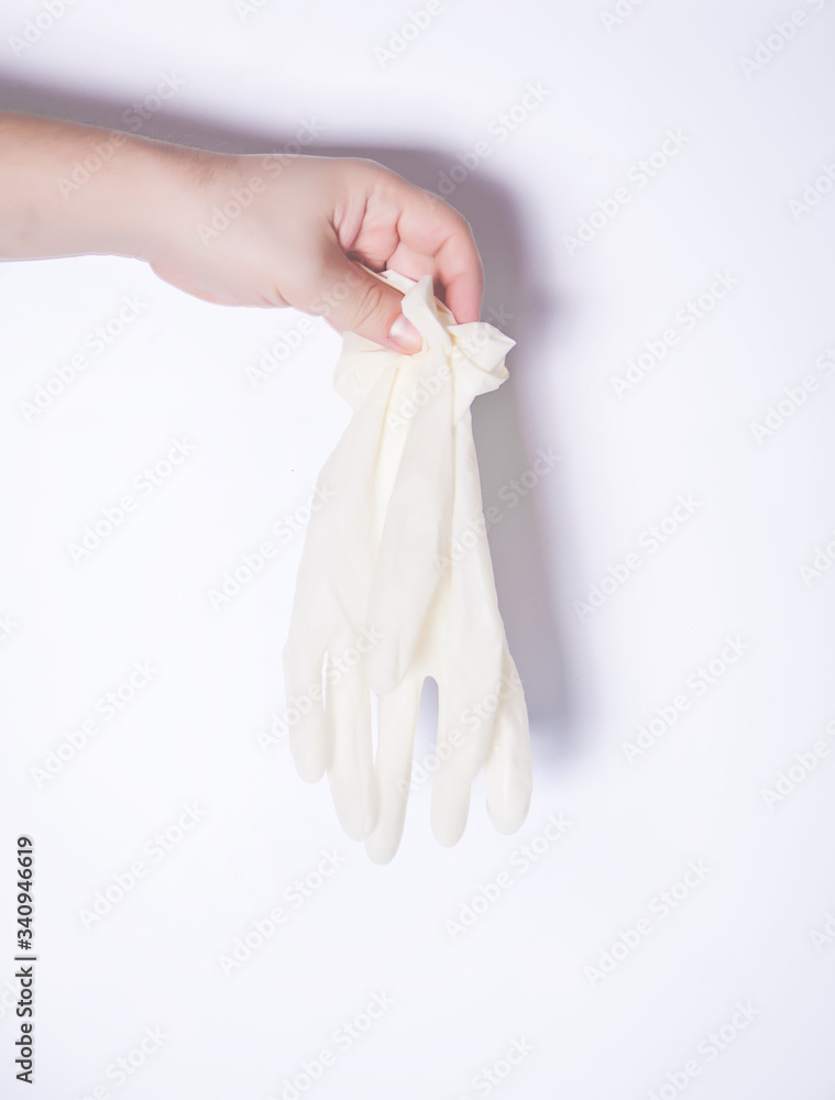 Man hand holding protective rubber gloves. Protection against contagious disease and coronavirus. Man hand holding protective rubber gloves. Protection against contagious disease and coronavirus.