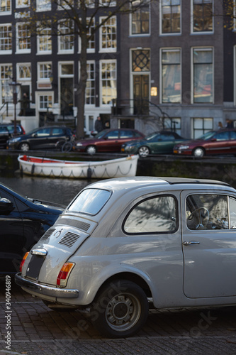 Fototapeta Naklejka Na Ścianę i Meble -  A car parked near an Amsterdam canal