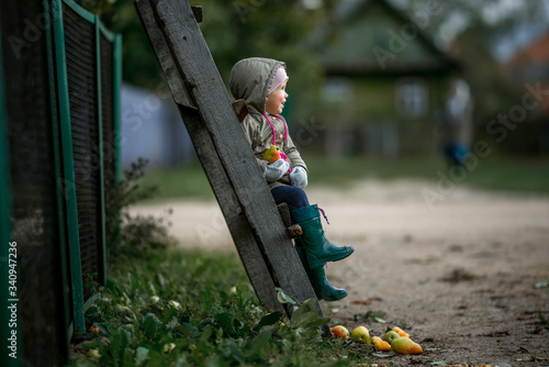 child walks in the village and harvests