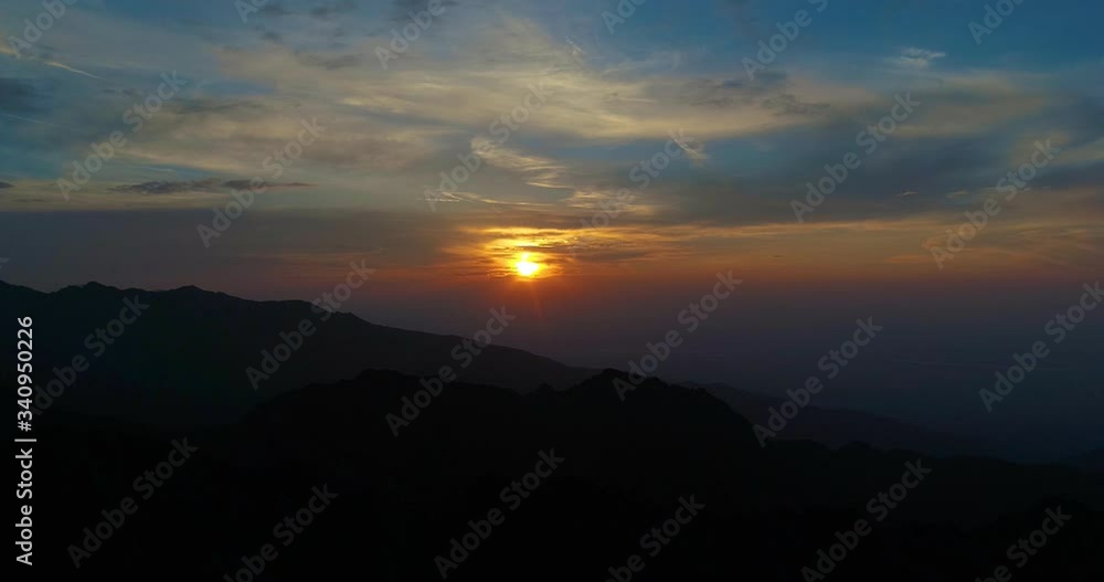 Mountains shaped by the light of the golden sunset.Extremely beautiful and dramatic aerial sunset with clouds, by drone. Mountains shaped by the light of the golden sunset.Extremely beautiful and dramatic aerial sunset with clouds, by drone.