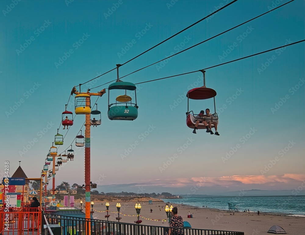 Beach boardwalk with an amusement park taken in Santa Cruz CA