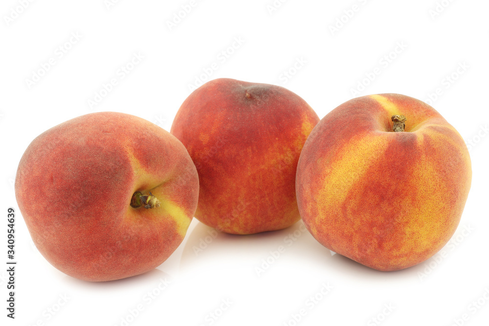 three fresh peaches on a white background three fresh peaches on a white background