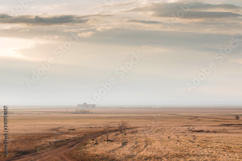 Steppe road  Elevator in the horizon