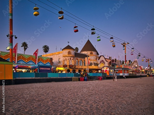 Fototapeta Beach boardwalk with an amusement park taken in Santa Cruz, CA