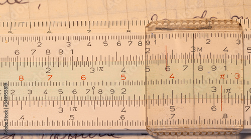 Cole up 1970s old Italian-made pocket slide rule mechanical calculator.
