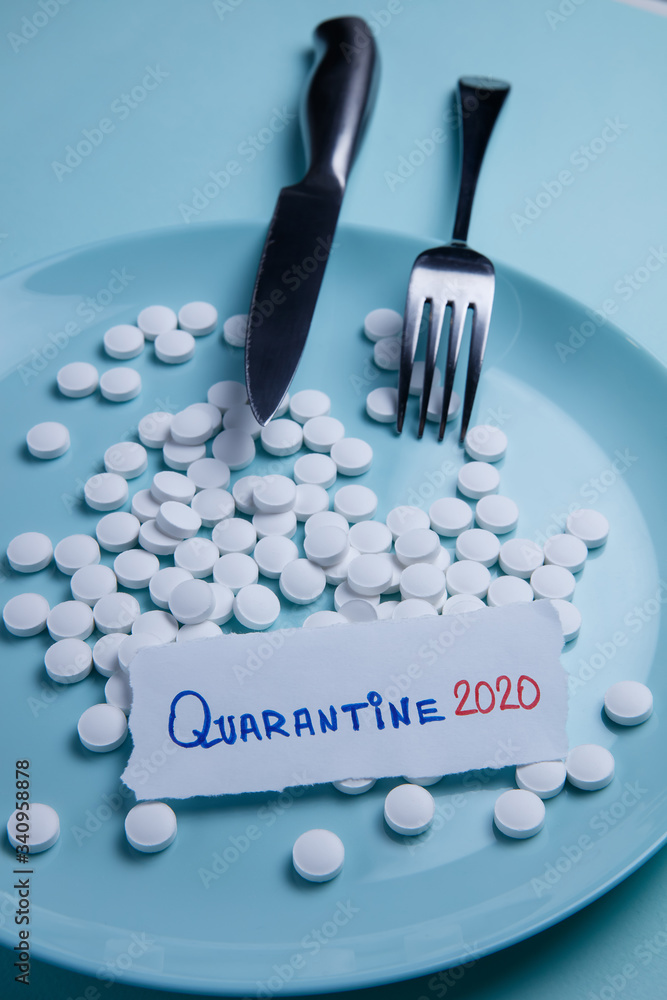 Fototapeta premium Quarantine pills on a plate