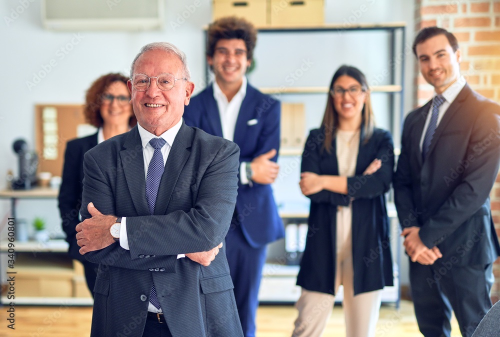 Group of business workers smiling happy and confident in a meeting. Standing with smile on face looking at camera at the office. Group of business workers smiling happy and confident in a meeting. Standing with smile on face looking at camera at the office.