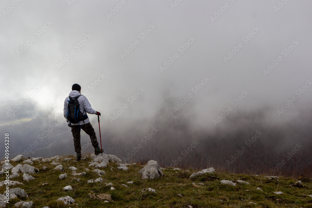 hiker on the top of a mountain hiker on the top of a mountain