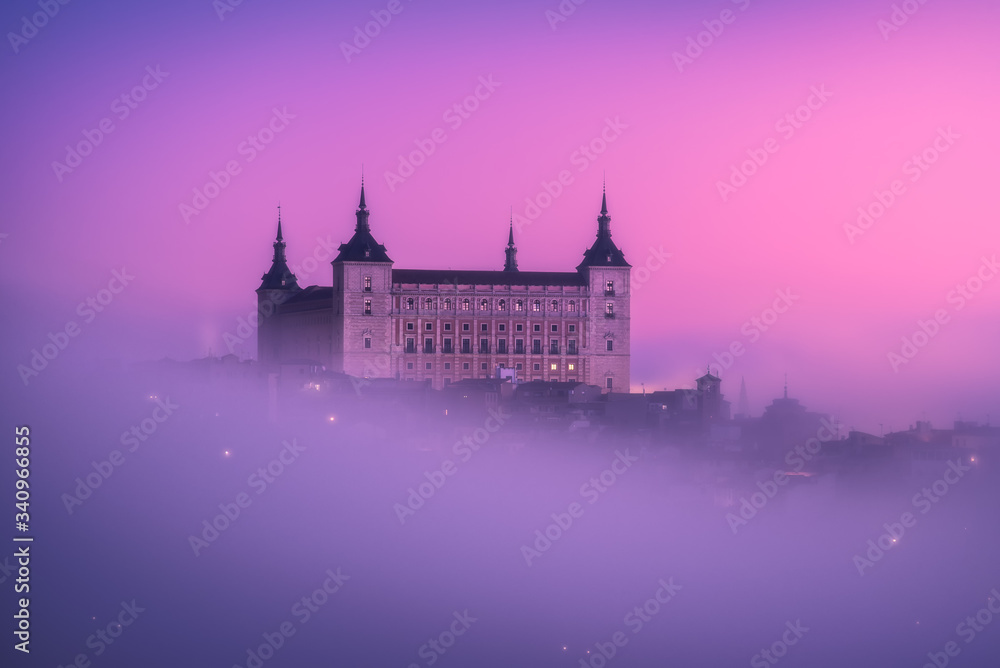 From above wonderful landscape of medieval castle built over city in misty colorful sunrise From above wonderful landscape of medieval castle built over city in misty colorful sunrise