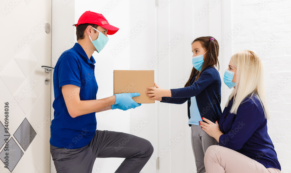 Courier delivering a parcel, delivery of things during quarantine Courier delivering a parcel, delivery of things during quarantine