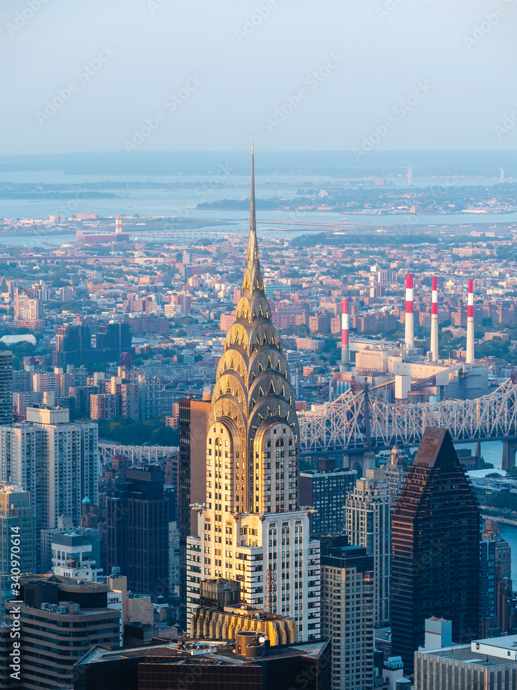 Architectural landmark Chrysler Building, an Art Deco–style skyscraper located in Manhattan, New York City, United States of America. - obrazy, fototapety, plakaty 