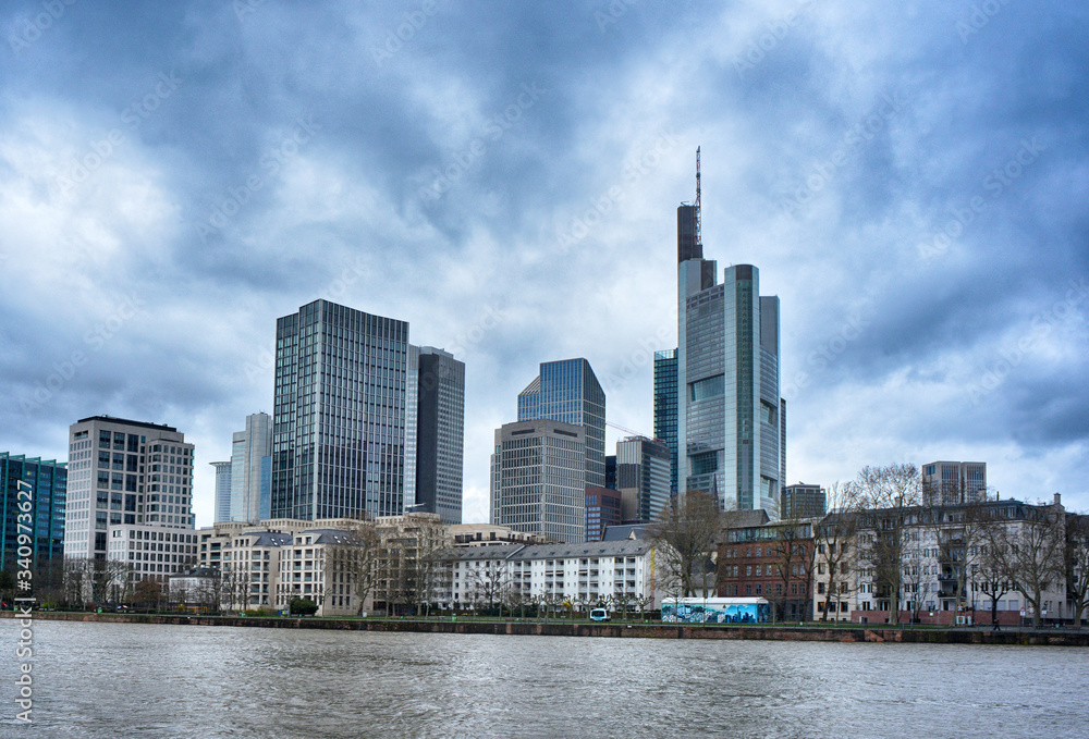 Skyline of Frankfurt Main view over the Main river with dramatic clouds
