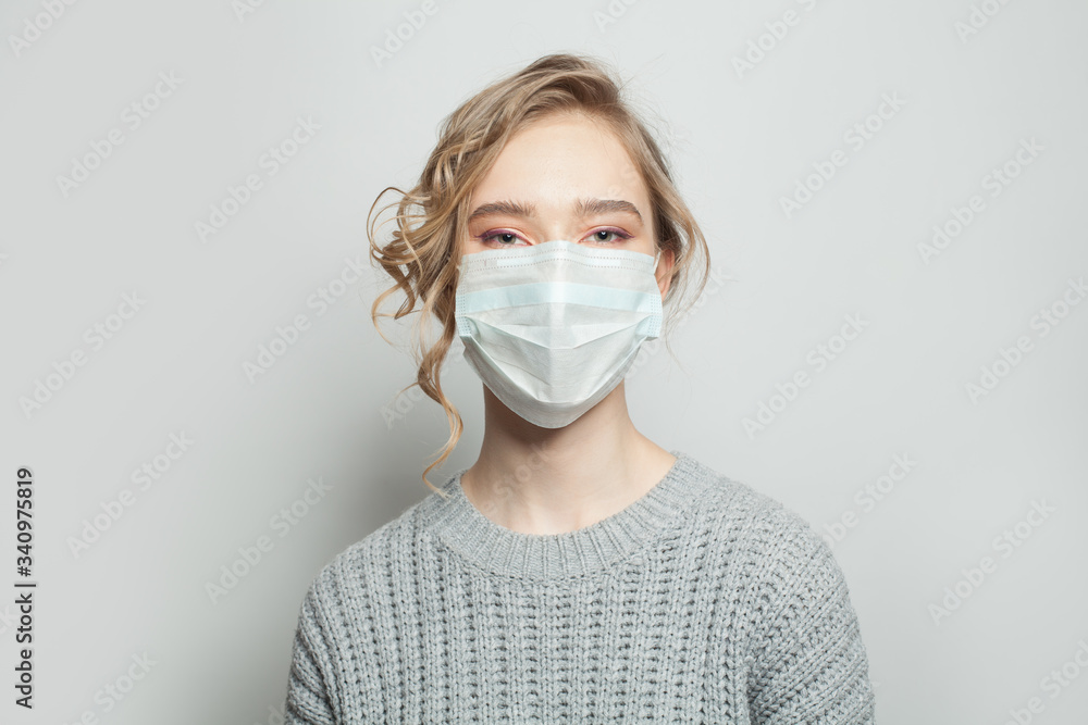 Woman in medical face mask on white background. Woman in medical mack. Flu epidemic and virus protection concept Woman in medical face mask on white background. Woman in medical mack. Flu epidemic and virus protection concept