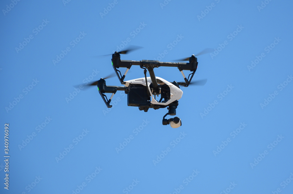 Low Angle View Of Drone Flying Against Sky Low Angle View Of Drone Flying Against Sky