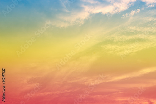 A soft fog cloug background with pastel colored orange to blue gradient © Theeranad