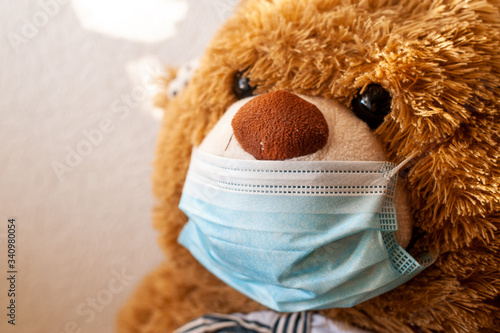 Bear both in protective medical masks. Stay at home quarantine coronavirus pandemic prevention. Prevention epidemic.