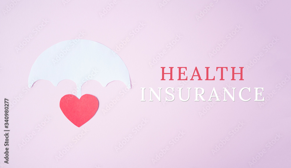 Red paper heart shape under white paper umbrella as life with words health insurance, health insurance concept. Assurance. insurance life symbol
