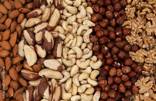 Different kind of nuts as a background, Brazil nuts, almonds, walnuts, cashew, hazelnuts