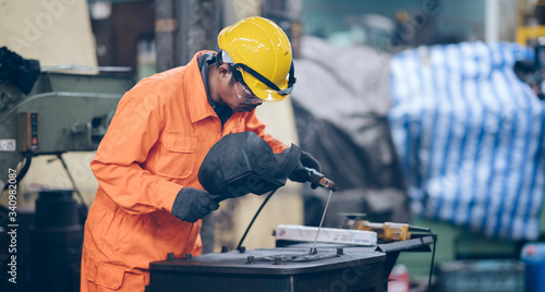 profession industrial Worker  welding steel structure at factory